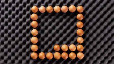 Stop motion of many brown eggs wiggling - playful food with copy space 動画素材 172111188