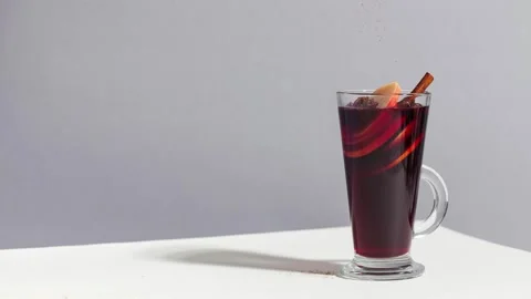 Stop motion mulled wine with a glass glass sprinkled with cinnamon. Stock Footage 143286360