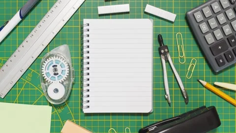 Stop Motion Notebook On Cutting Mat With School &amp; Office Supplies Stock Footage 315080643
