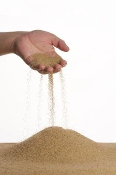 Stop motion. From the palm of the sand flows down. Male hand. Stock Photos