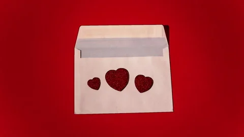 Stop motion pencil scketch Animation of a love letter with red hearts coming out Stock Footage 229655854