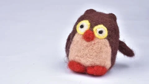 Stop motion penguin waving its paw. Felting activity. Stock Footage 233901289