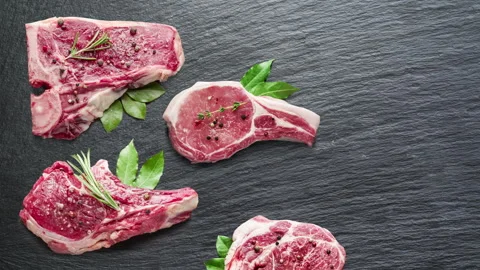 Stop motion of perfect meat steak cuts on dark board. Stock Footage 329167638