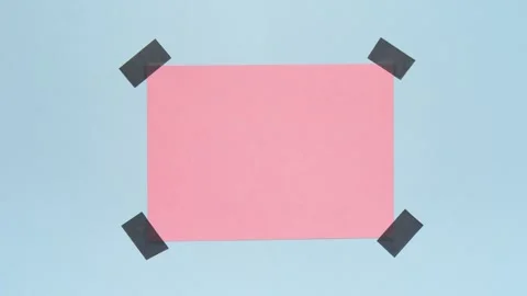 Stop Motion Pink Paper Appears and Gets Taped on Blue Background Stock Footage 315741938