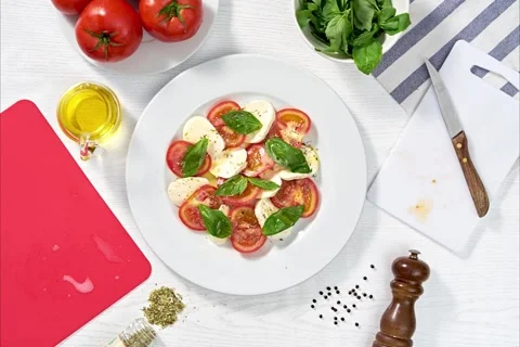 Stop motion preparation of a caprese salad. Stock Footage 166832137