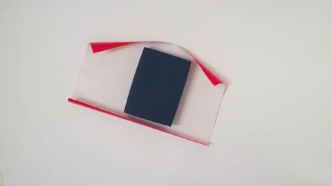 Stop motion of present packing in red wrapping paper Stock Footage 80670434