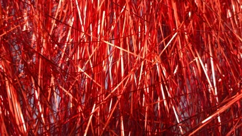 Stop motion Red foil tinsel background, Shimmer shiny red tinsel shred festive, Video stock 321861653