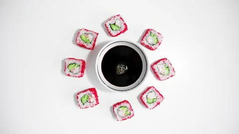 Stop motion rolls, sushi on the table around soy sauce. Japanese food. Rolls Vidéo 137409386