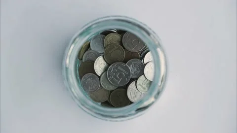Stop motion - ruble coins are added to the bank piggy bank Stock Footage 200273103