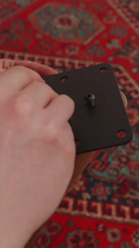 Stop motion sequence of metal nuts tightening on table frame Stock Footage 346396564