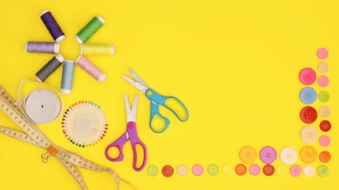 Stop motion of sewing material scissors, threads, thumbtacks, meter and buttons Stock-Footage 120215382