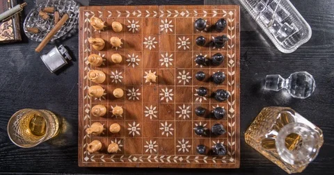 Stop motion of a short game of chess with a glass of whiskey and a cigar Stock Footage 72955238