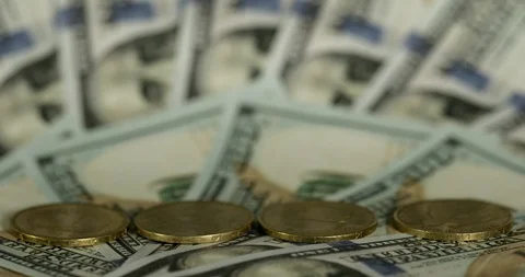 Stop motion. Stacks of coins on a background of dollars. Stock Footage 123653578