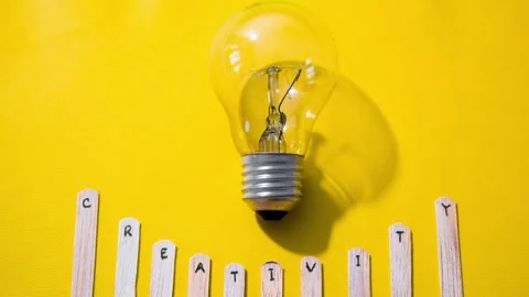 Stop motion Stick Ice cream with word Creativity with lightbulb on yellow Stock Footage 287780870