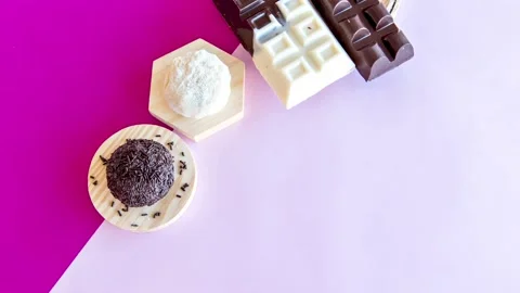 Stop motion sweets on pink background Stock Footage 155070364