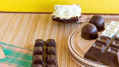 Stop motion Sweets on the table. Chocolate cake, brownie and chocolate bar Stock Footage 155072255