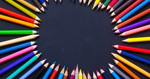 Stop motion : top view a color pencil on black color table Stock Footage 90601044