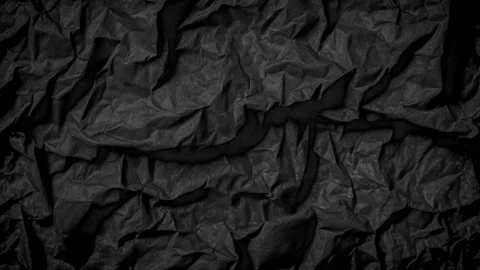 Stop Motion Transforming Shapes of Crumpled Black Paper Stock Footage 295069732