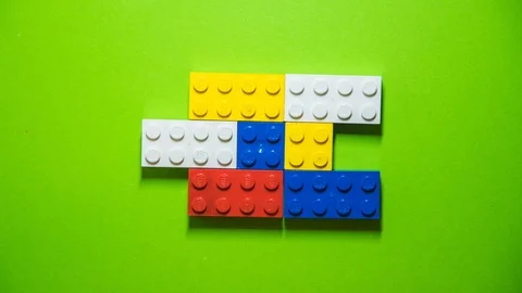 Stop motion transition with legos, top view, with green screen in the Stock Footage 115353488