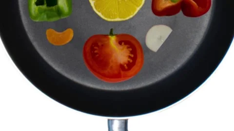 Stop motion of the vegetables in a black skillet. Healthy nutrition concept. Stock Footage 167412735