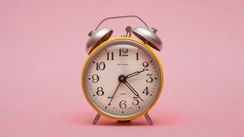 Stop Motion video. An analog yellow clock. Video stock 141647885