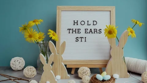 Stop motion video animation Letter board with message HOLD THE EARS STIFF on Stock Footage 319428604