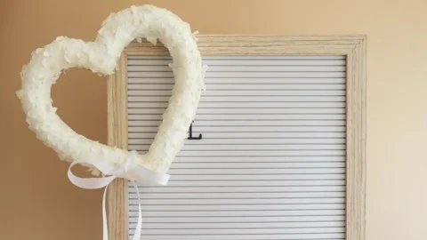Stop motion video animation LOVE IS IN THE AIR phrase Symbol of love beautiful Stock Footage 316064661