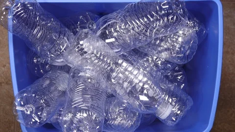 Stop motion video of blue bin filling up with plastic bottles Видео 121985068