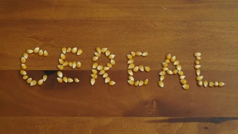 Stop motion video of corn kernel forming the word "cereal". Stock Footage 160129373