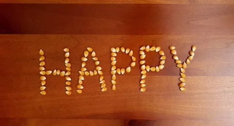 Stop motion video of corn kernel forming the word "corn". Stock Footage 160432641