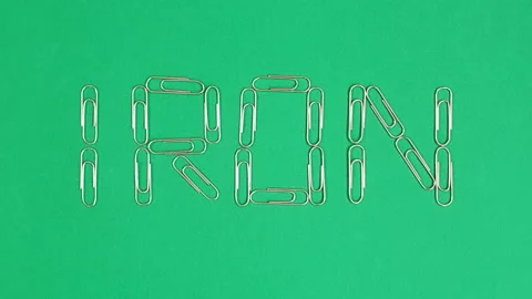 Stop motion video of cowpea or black-eyed pea forming the word "iron". Stock Footage 161748404