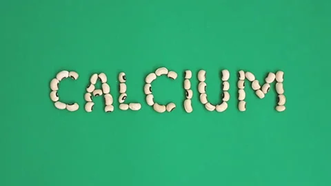 Stop motion video of cowpea or black-eyed pea forming the word "calcium". Stock Footage 161828115