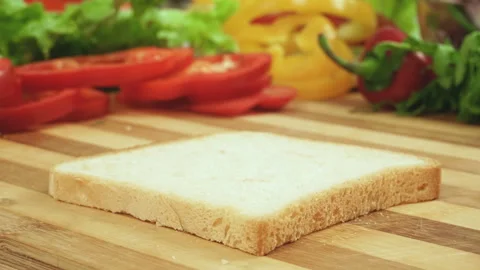 Stop motion video of making sandwich with tomato, ham, bow, cheese and salad Stock Footage 87786814