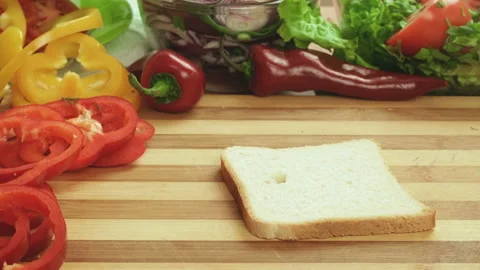 Stop motion video of making sandwich with ham, cheese and salad. tomato juice Stock Footage 87787460