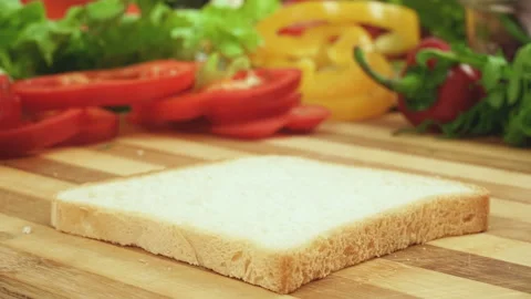Stop motion video of making sandwich with tomato, ham, bow, cheese and salad Stock Footage 87876278
