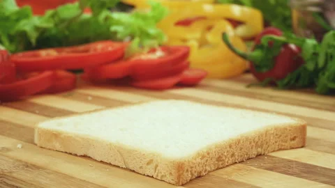 Stop motion video of making sandwich with tomato, ham, bow, cheese and salad Stock Footage 87978878