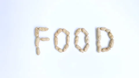Stop motion video of peanuts forming the word "Food". Stock Footage 161350561