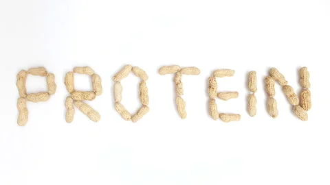 Stop motion video of peanuts forming the word "Protein". Stock Footage 161351014