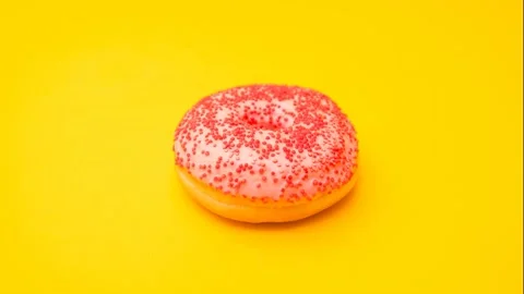 Stop motion video. A pink donut Video stock 141683350