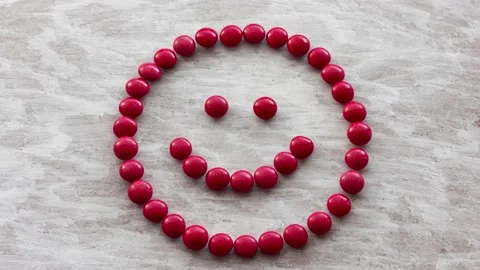 Stop motion video with a smiling positive emoticon appearing. Stock Footage 163528218