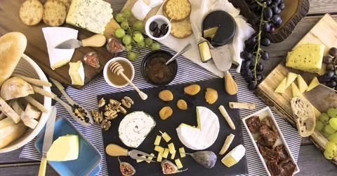 Stop motion view of an assortment of French and British cheese Stock Footage 71860540
