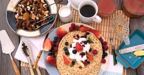 Stop motion view of a breakfast of pancakes with berries and dry fruits Stock Footage 73132744