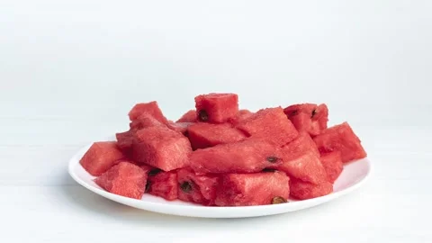 Stop motion watermelon slices disappear on the white plate. Stock Footage 138687972