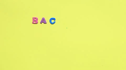 Stop motion words from multi colored letters on a yellow background. Stock Footage 160089236