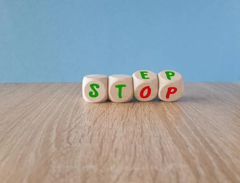 Stop or next step symbol. Turned cubes and changes the word 'stop' to 'step'. Stock Photos