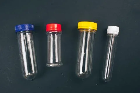 Stop plastic pollution. Empty colorful plastic containers on dark background 写真素材