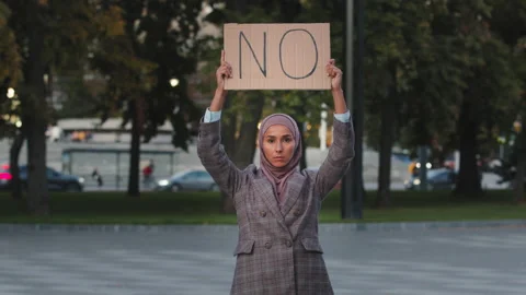 Stop racism concept Arab immigrant Muslim woman in hijab protests against Video stock 163279047