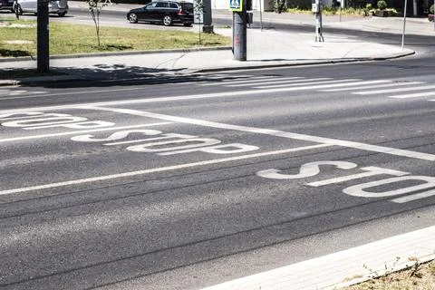 Stop road marking on asphalt. Intersection traffic control lines. City stre.. Stock Photos