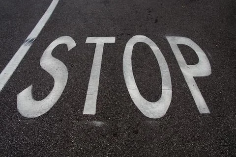 Stop road marking Stock Photos