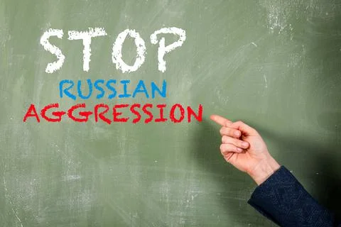Stop Russian Aggression. Text on a green textured board Stock Photos